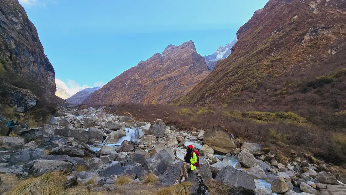The dry, rocky moraine and river valley on the long descent.